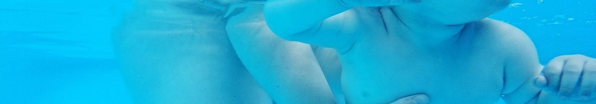 Parent With Toddler Under Water